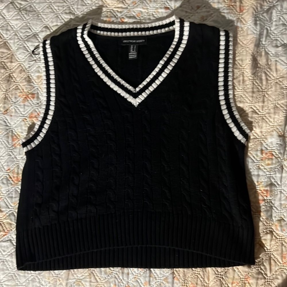 Black and white vest.